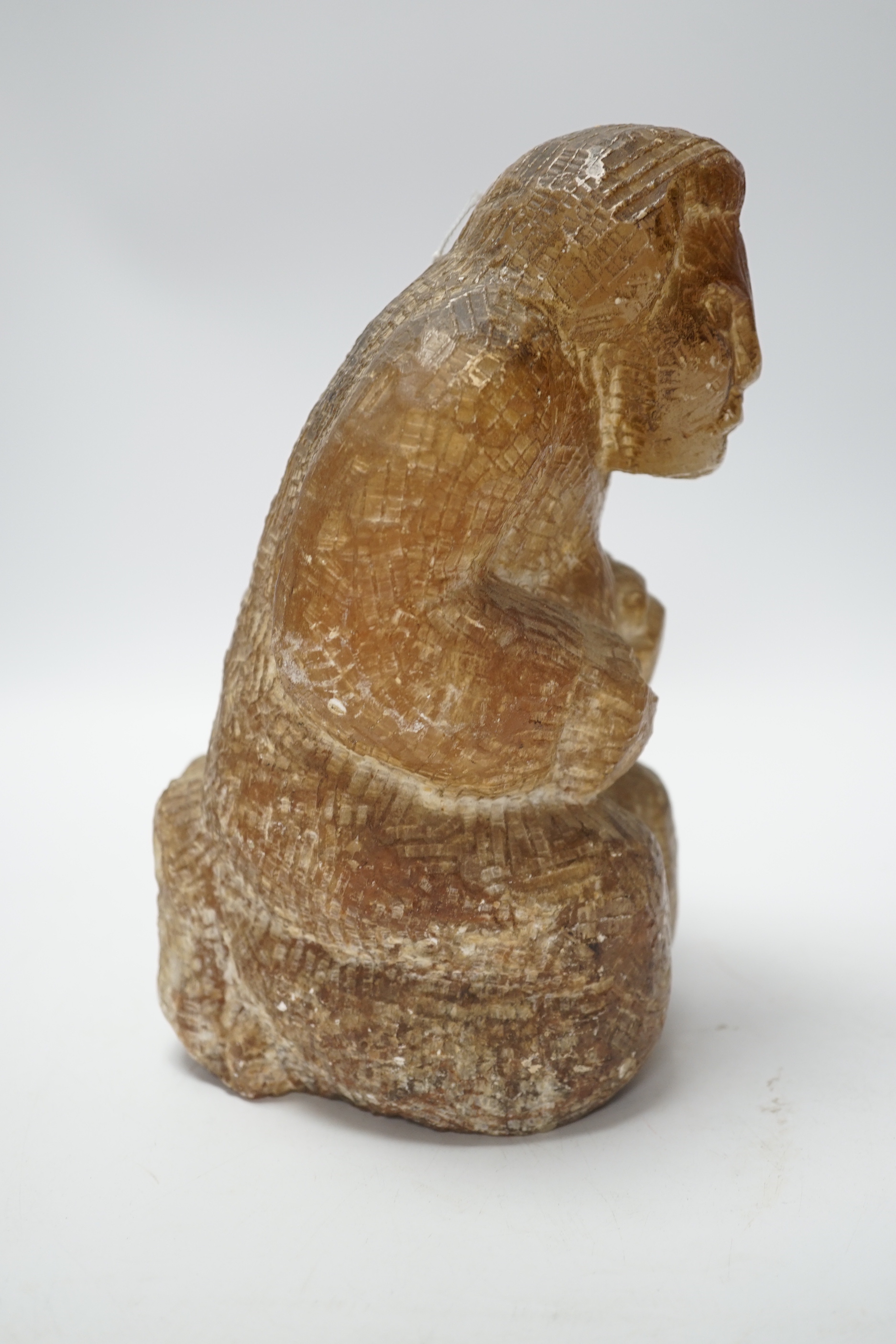 A soapstone Inuit carved figure, 22cm high